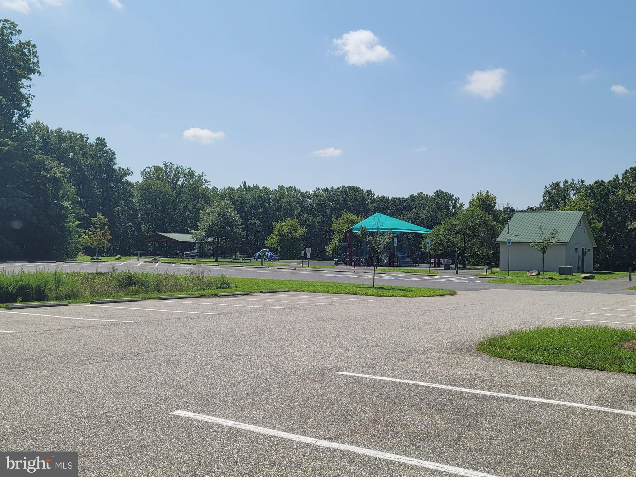 9420 Fairview Avenue Laurel, MD 20723 - Photo 69 of 70 a view of a golf course with a lake