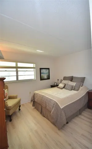a view of a room with an empty space and a ceiling fan
