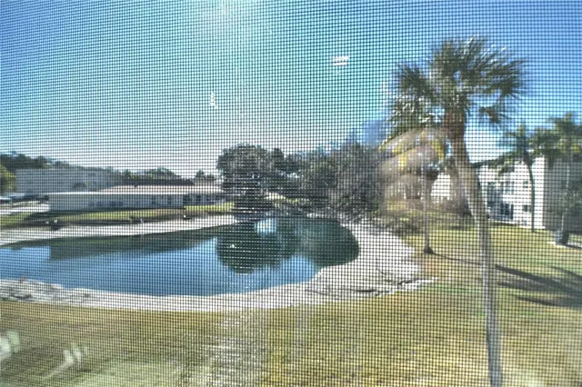 a view of building with yard and staircase