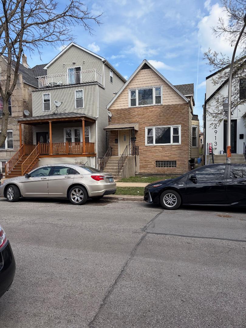 2915 North Spaulding Avenue Chicago, IL 60618 - Photo 1 of 4 a car parked in front of a building
