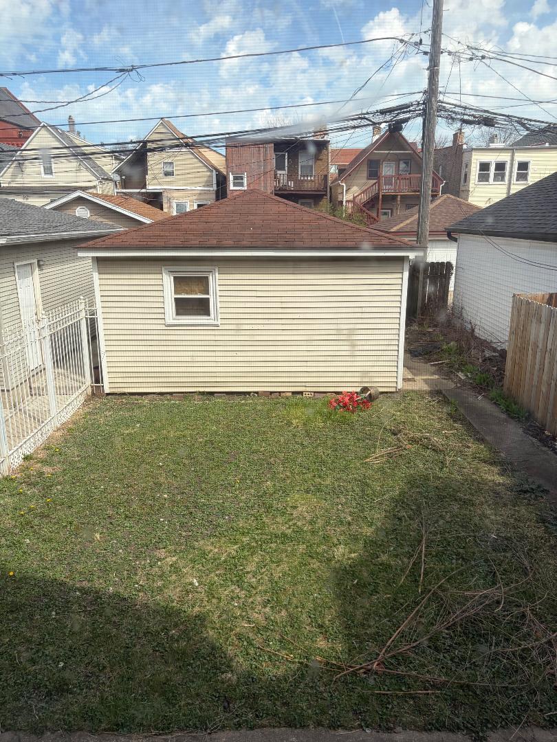 2915 North Spaulding Avenue Chicago, IL 60618 - Photo 3 of 4 a view of a house with a yard