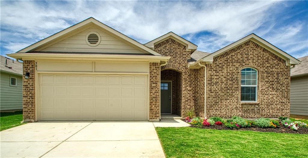 a view of front a house with a yard