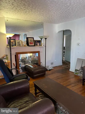 a bedroom with furniture and a fireplace