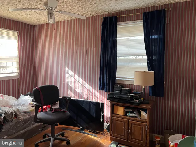 a room with a chair and a window