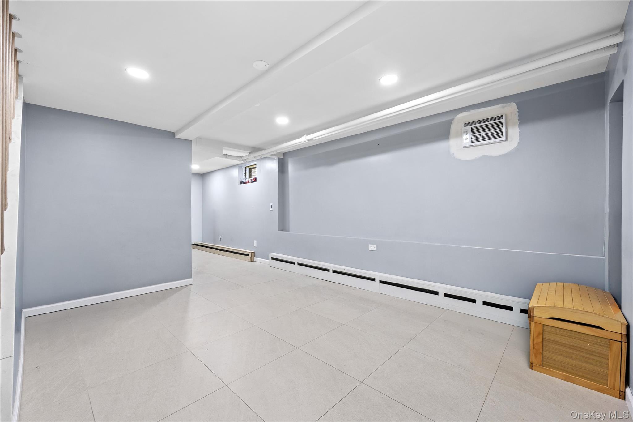 22-29 73rd Street Queens, NY 11370 - Photo 15 of 24 Finished basement with recessed lighting