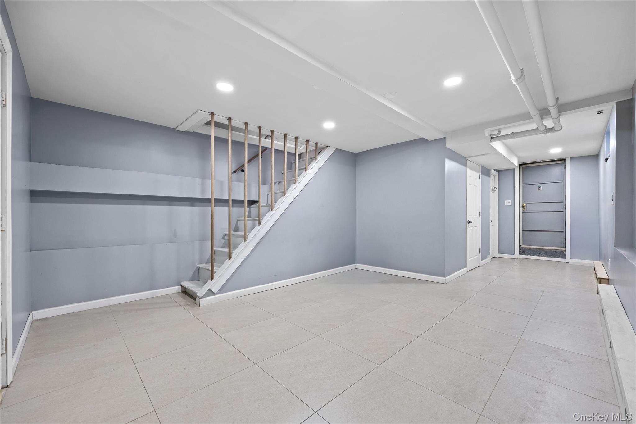 22-29 73rd Street Queens, NY 11370 - Photo 16 of 24 Finished Basement