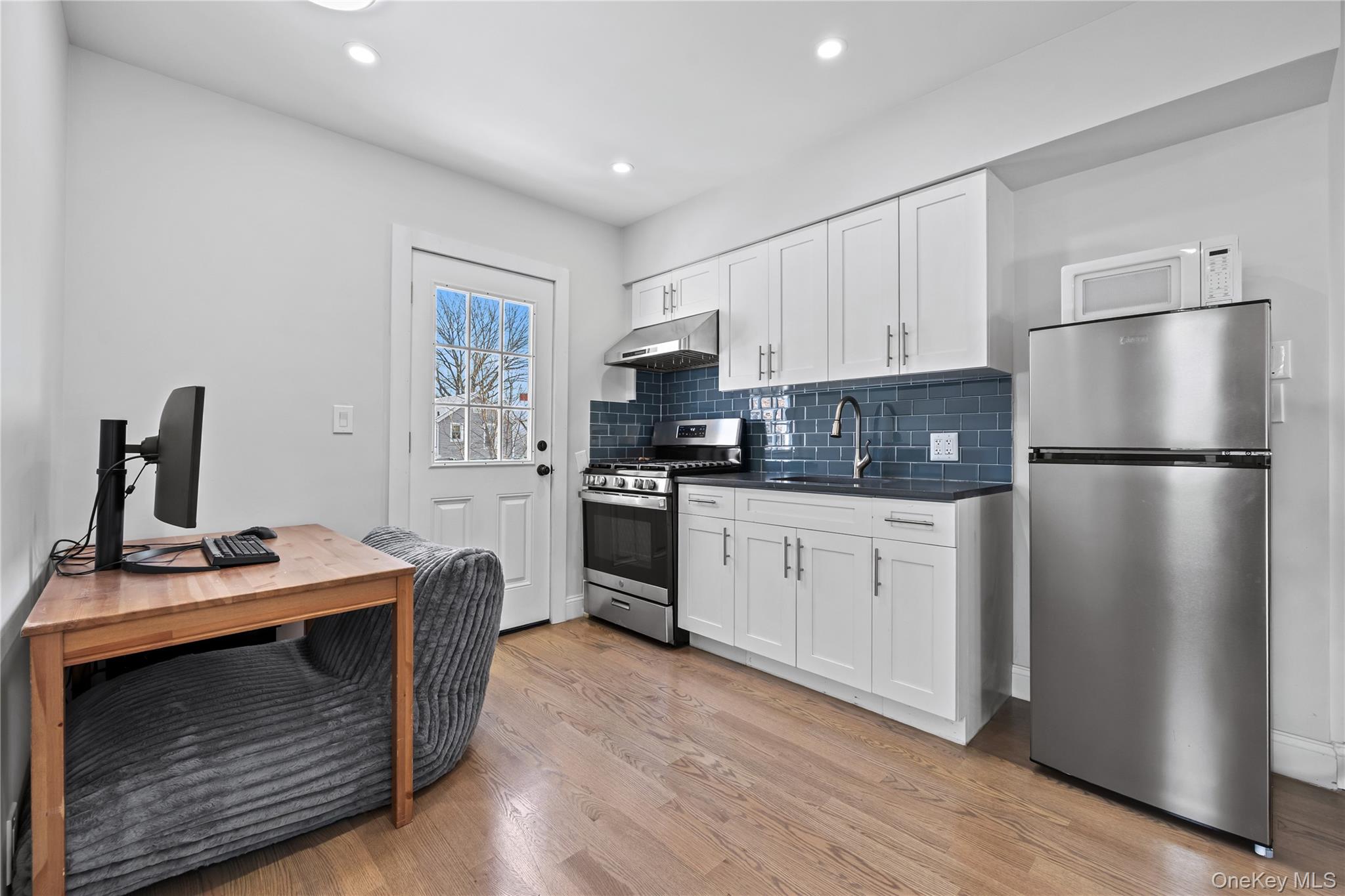 22-29 73rd Street Queens, NY 11370 - Photo 10 of 24 Kitchen - 2nd Floor with stainless steel appliances and white cabinetry