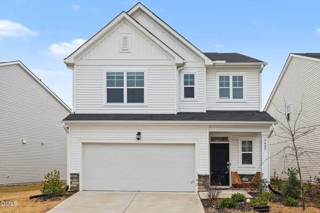 a view of house that has a car park front of house