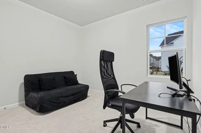 a living room with furniture and a piano