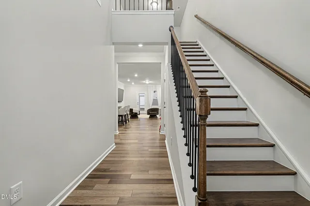 a view of wooden door and chair in the balcony