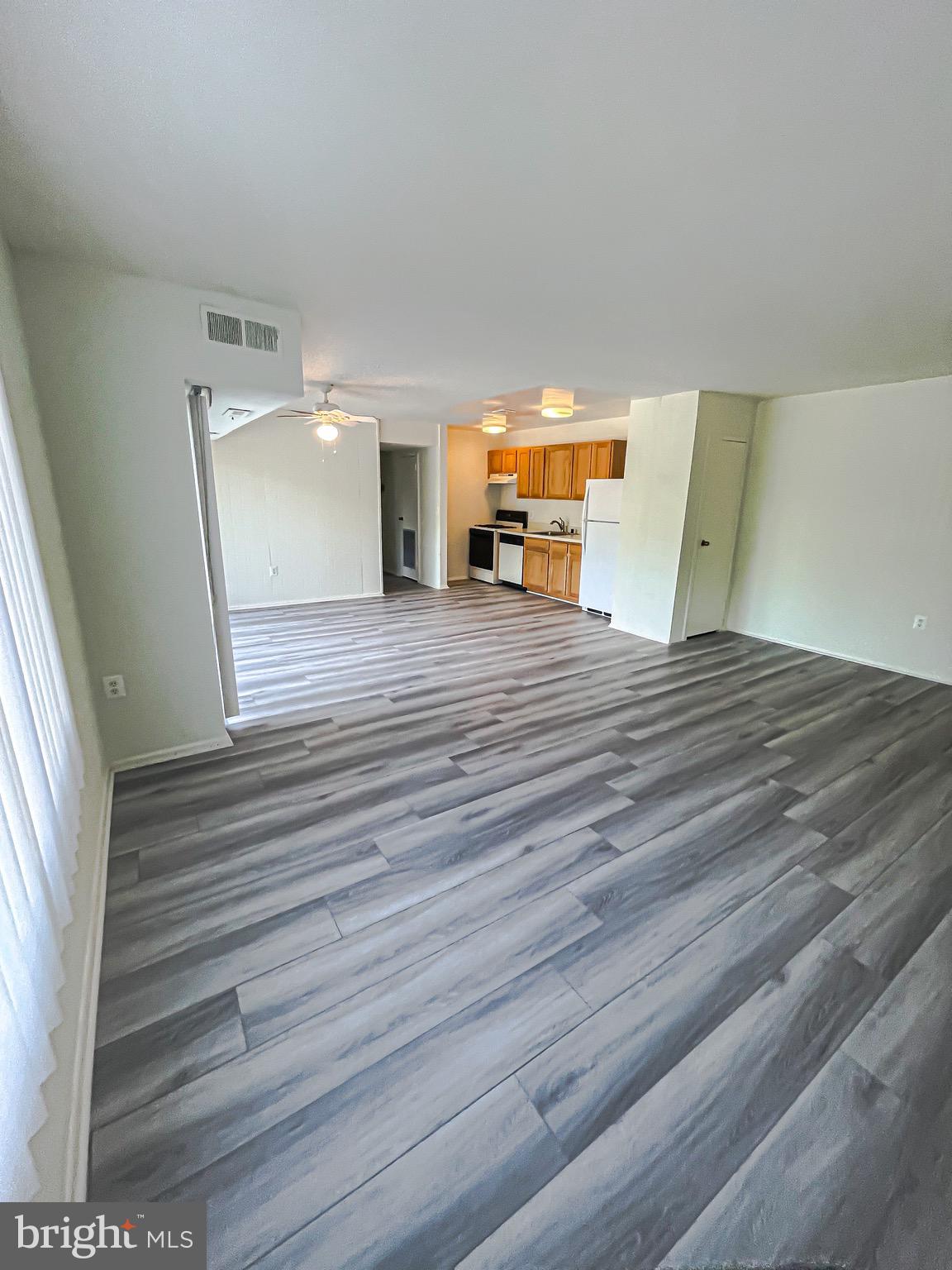 3840 Bel Pre Road, Unit 7 Silver Spring, MD 20906 - Photo 6 of 31 Open - Concept Living Room/ Dining Room/ Kitchen