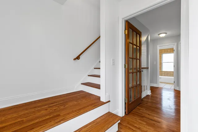 a view of a brick house with many windows