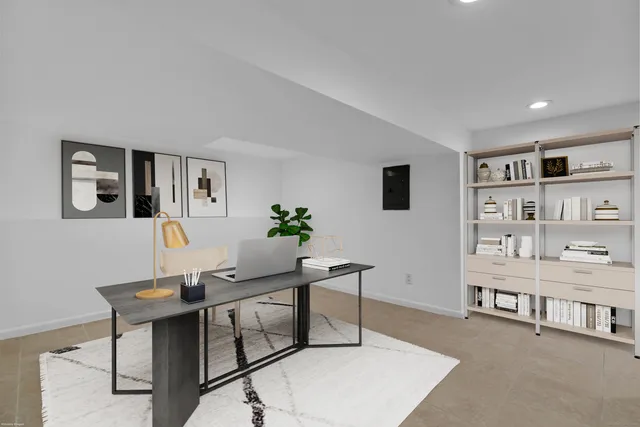 a picture of a bench in front of a wall