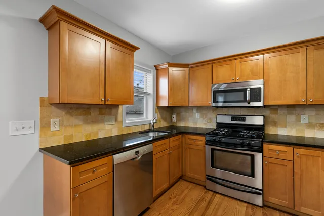 a view of a hallway with the wooden floor