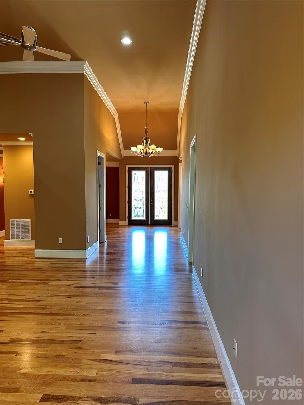 26 Stone House Road Arden, NC 28704 - Photo 3 of 21 a view of a hallway with wooden floor and a large mirror