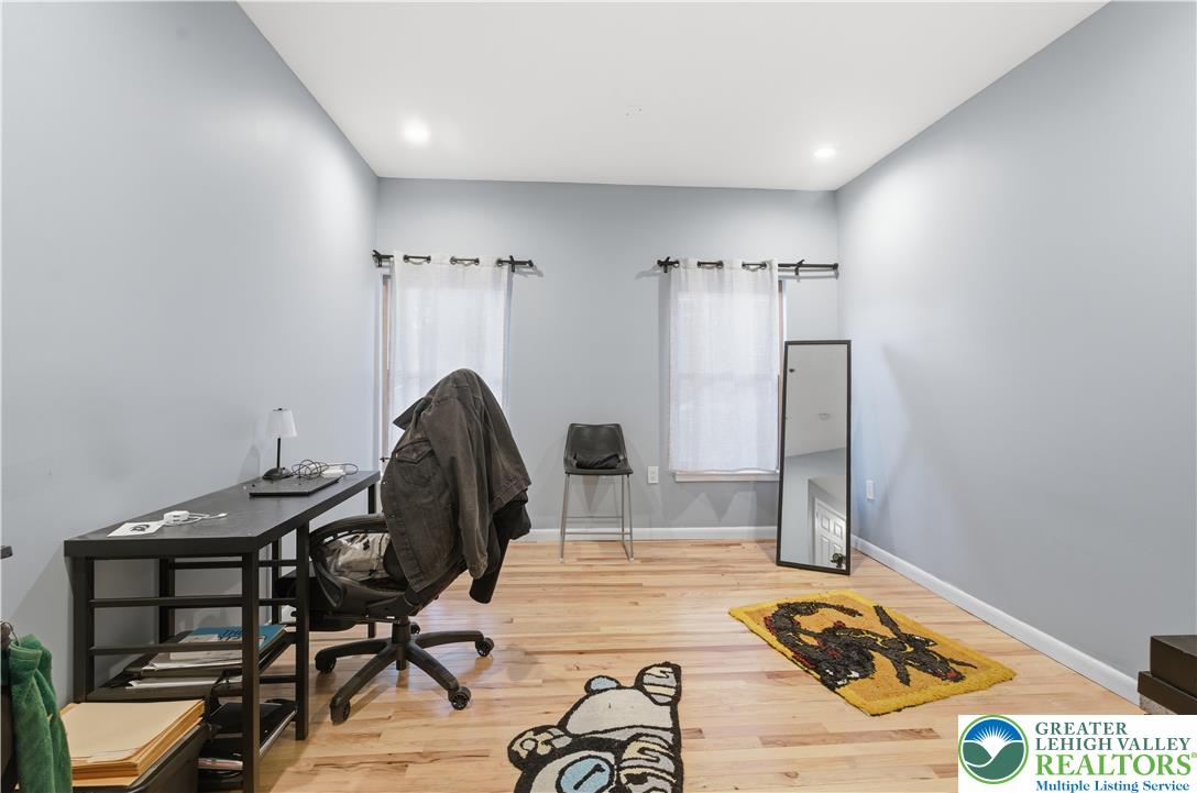 623 Walnut Street, Unit A2 Easton, PA 18042 - Photo 11 of 21 a room with furniture and a wooden floor