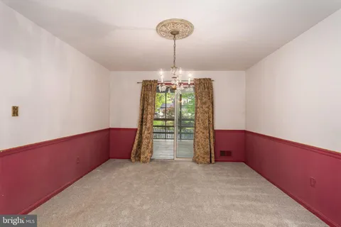 a furnished livingroom with a window