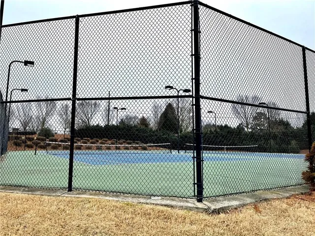 a view of a tennis net and a tennis court