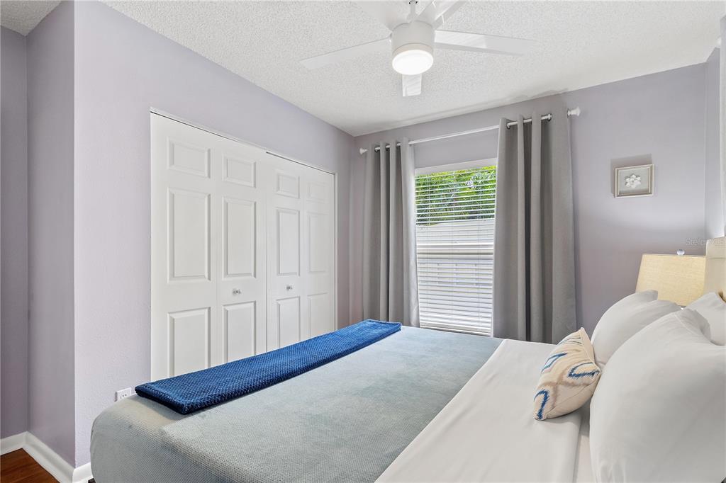 5596 100th Way North St. Petersburg, FL 33708 - Photo 20 of 67 a bedroom with a bed and a window