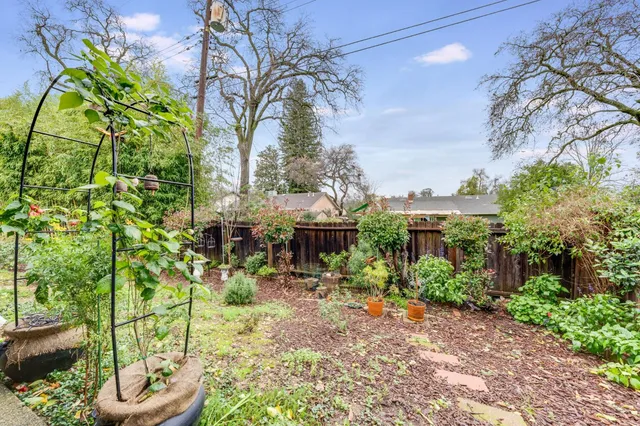 an aerial view of a house with a yard basket ball court and outdoor seating