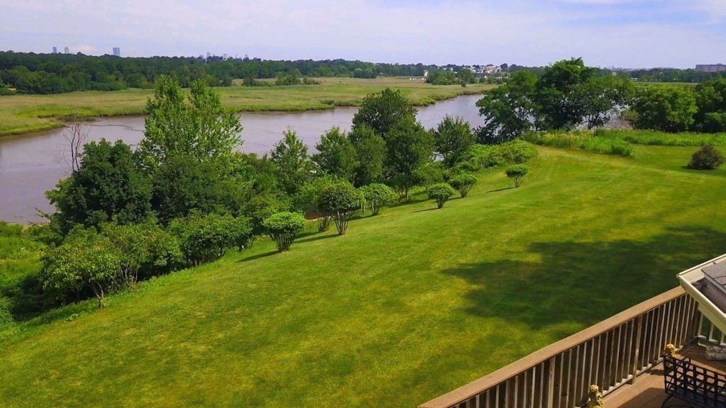 106 Forbes Road Milton, MA 02186 - Photo 12 of 27 a view of a lake with a city view