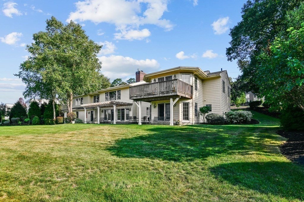 106 Forbes Road Milton, MA 02186 - Photo 6 of 27 a front view of a house with a yard