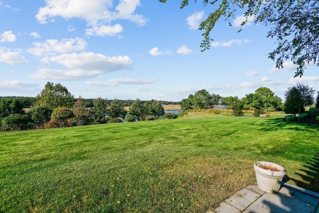 106 Forbes Road Milton, MA 02186 - Photo 10 of 27 a view of a backyard of the house