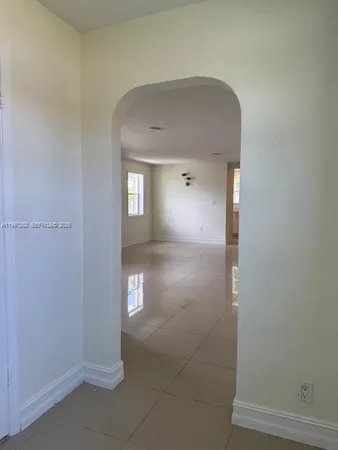 a view of a hallway with closet area