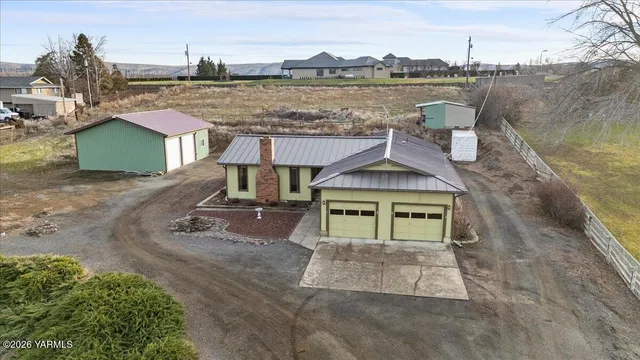 an aerial view of a house with lake view