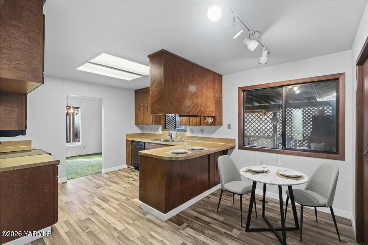 10802 Zier Road Yakima, WA 98908 - Photo 14 of 46 a view of a kitchen area with furniture and window