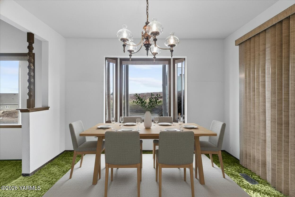 10802 Zier Road Yakima, WA 98908 - Photo 22 of 46 a view of a dining room with furniture window and outside view
