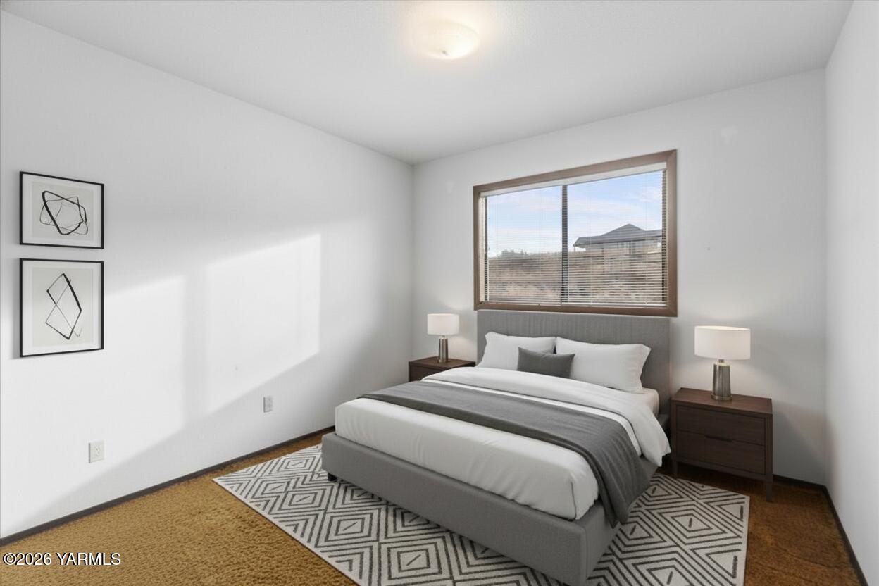 10802 Zier Road Yakima, WA 98908 - Photo 34 of 46 a bedroom with a bed and a window