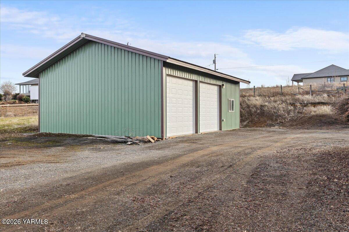 10802 Zier Road Yakima, WA 98908 - Photo 8 of 46 a view of a house with a backyard