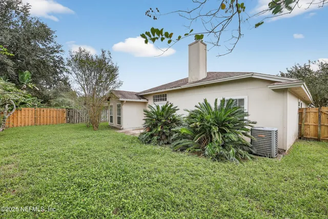 a house with a tree in front of it