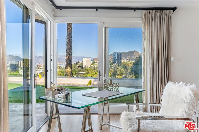 a view of a dining room with furniture window and outside view