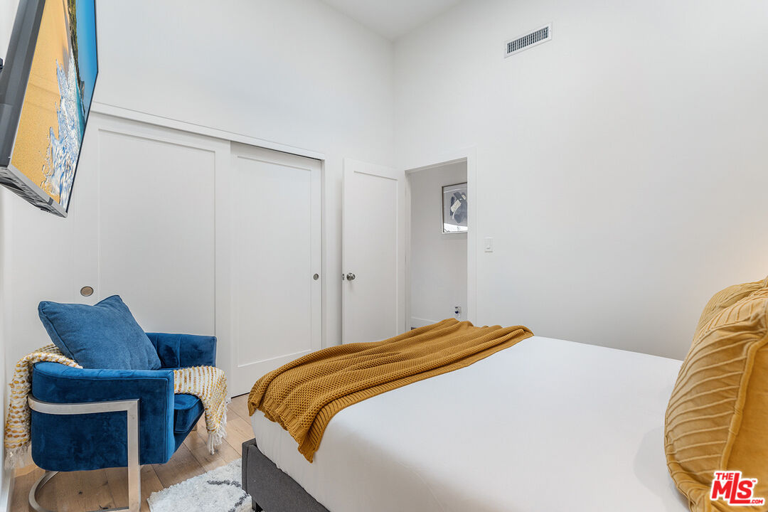 10901 Terryview Drive Studio City, CA 91604 - Photo 36 of 50 a bedroom with a bed and a chair