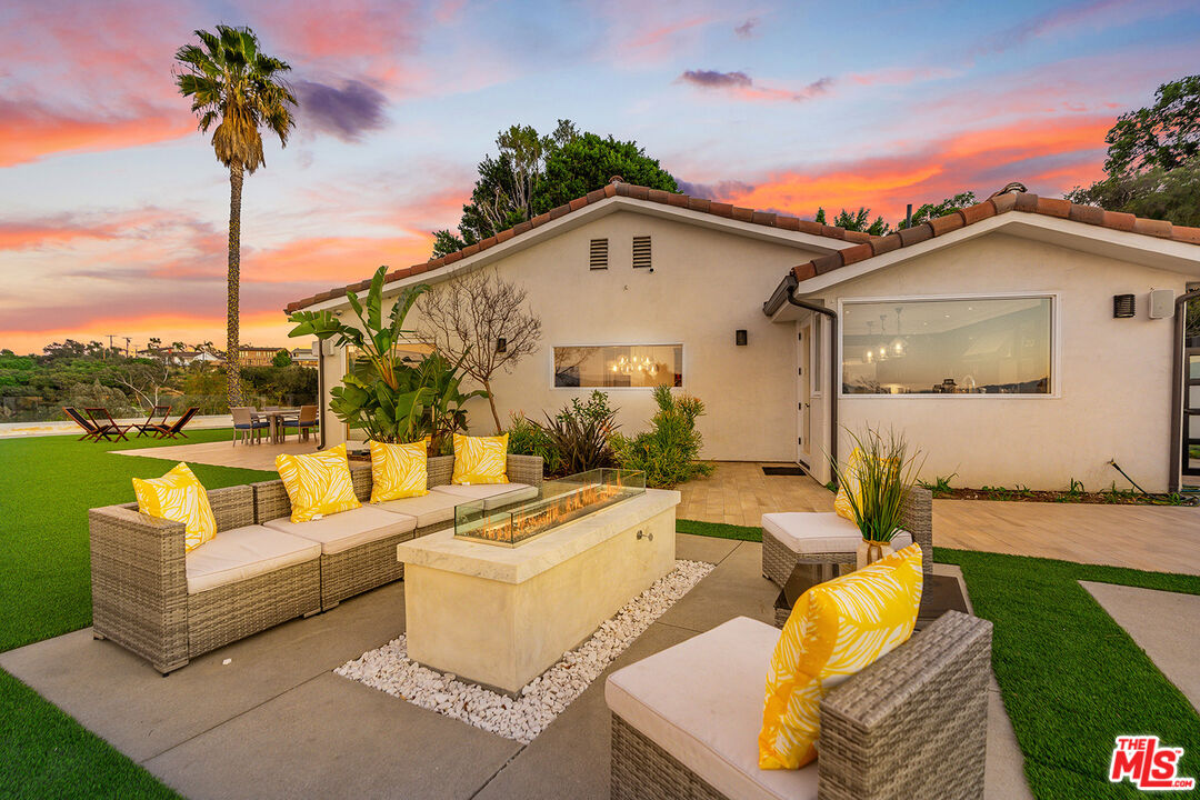 10901 Terryview Drive Studio City, CA 91604 - Photo 48 of 50 a front view of a house with swimming pool and dining table