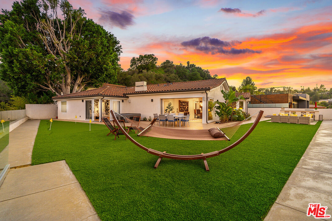 10901 Terryview Drive Studio City, CA 91604 - Photo 49 of 50 a view of a house with a backyard porch and sitting area