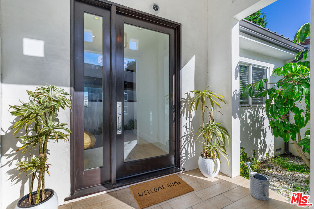 10901 Terryview Drive Studio City, CA 91604 - Photo 5 of 50 a glass door with a glass door and glass door