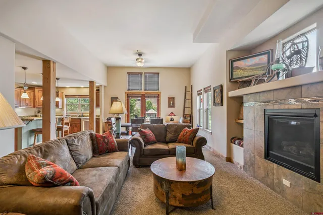a living room with furniture and a fireplace