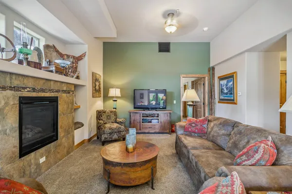 a living room with furniture and a large window