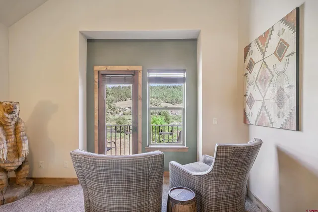 a bathroom with a tub a sink and a mirror