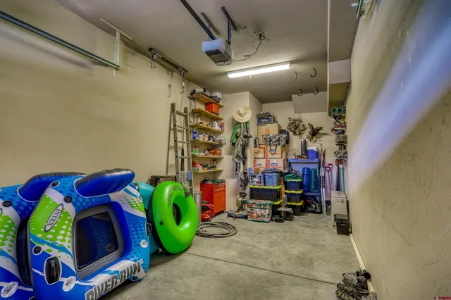 a view of a building with a fountain and a yard