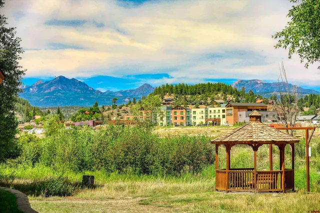 a view of a lake with a yard