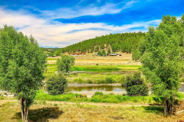 a aerial view of a house with swimming pool and sitting area