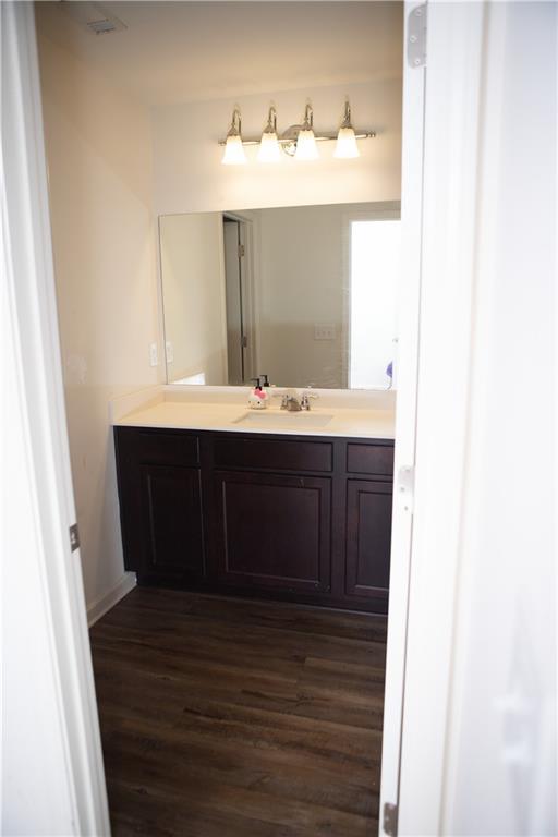 11900 Fuller Street Hampton, GA 30228 - Photo 13 of 17 a bathroom with a sink vanity and mirror