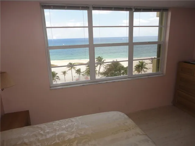 a bathroom with a tub sink vanity and a mirror