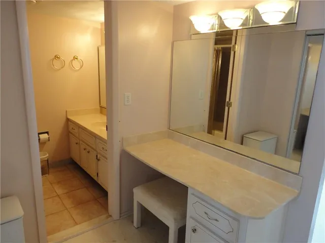 a bathroom with a tub and shower