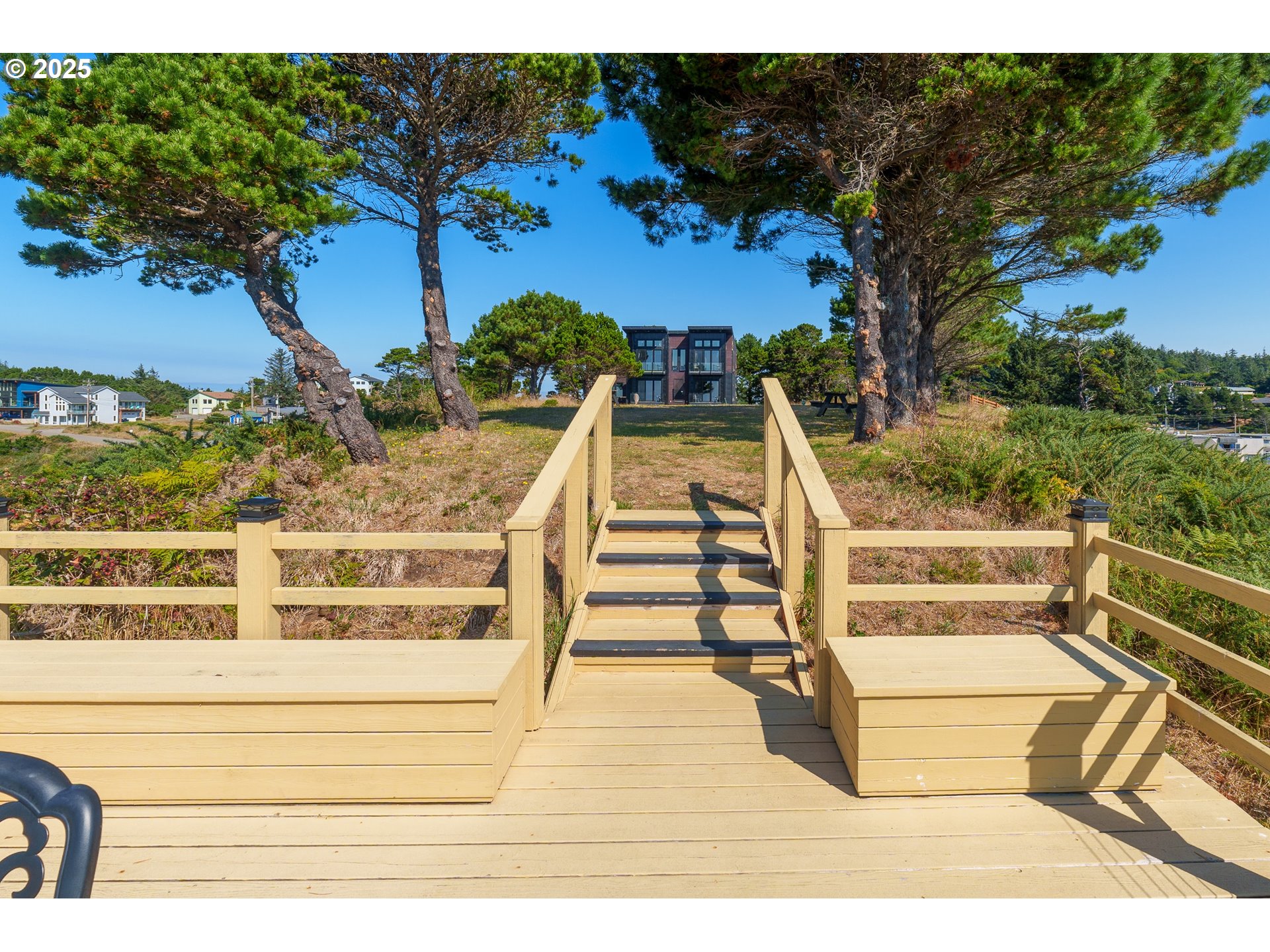 409 Jackson Street Port Orford, OR 97465 - Photo 12 of 48 a view of a balcony with wooden floor and potted plants