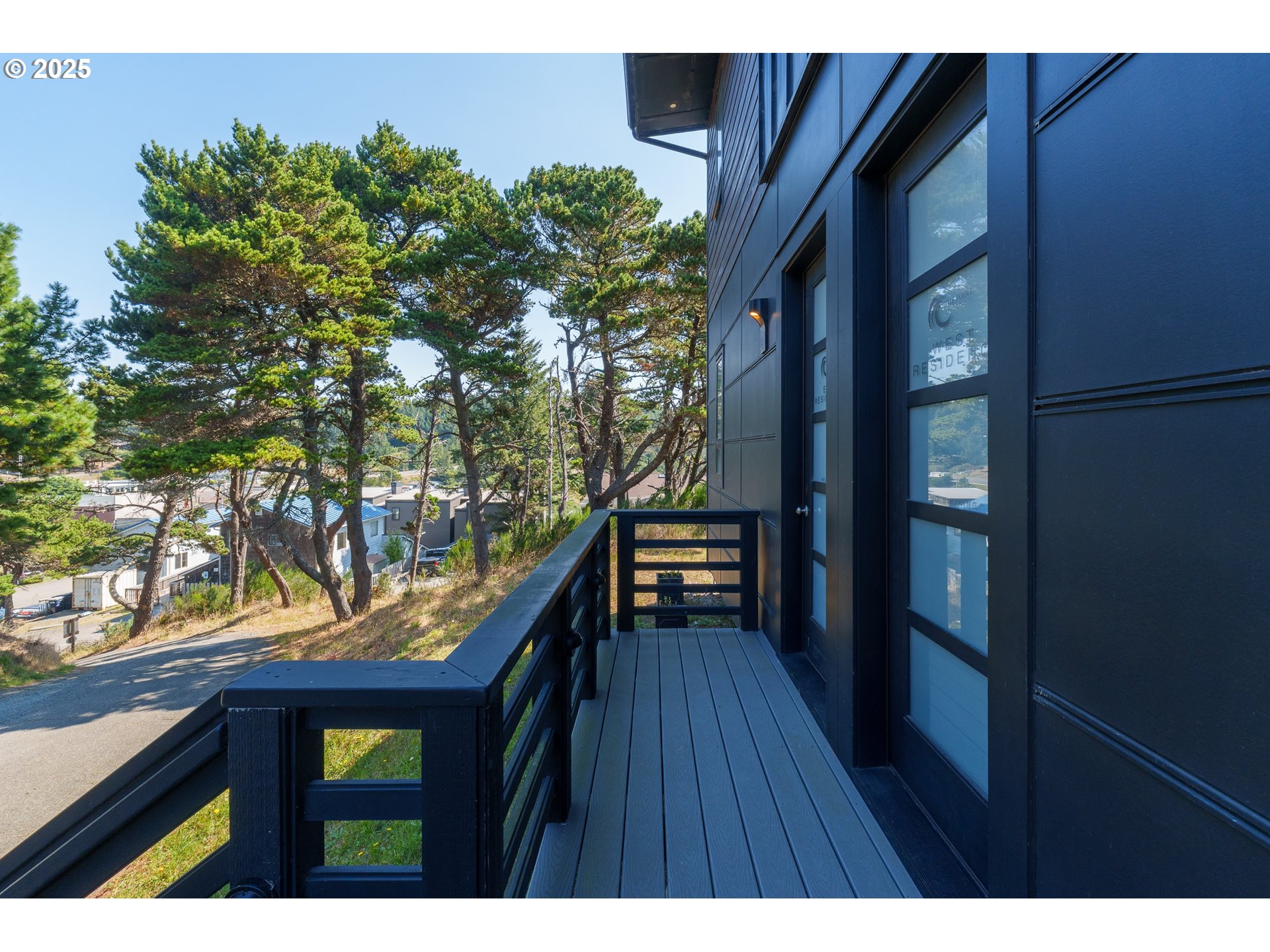 409 Jackson Street Port Orford, OR 97465 - Photo 14 of 48 a balcony with wooden floor and outdoor seating